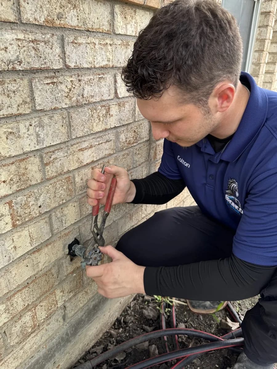 Bronco Plumbing technician performing slab leak repair at a DFW residence